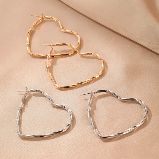 Elegant Sweet Heart Shape Spiral Stripe Alloy Hollow Out Women'S Earrings