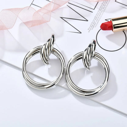 Exaggerated Metal Knotted Twist Geometric Round Creative Earrings