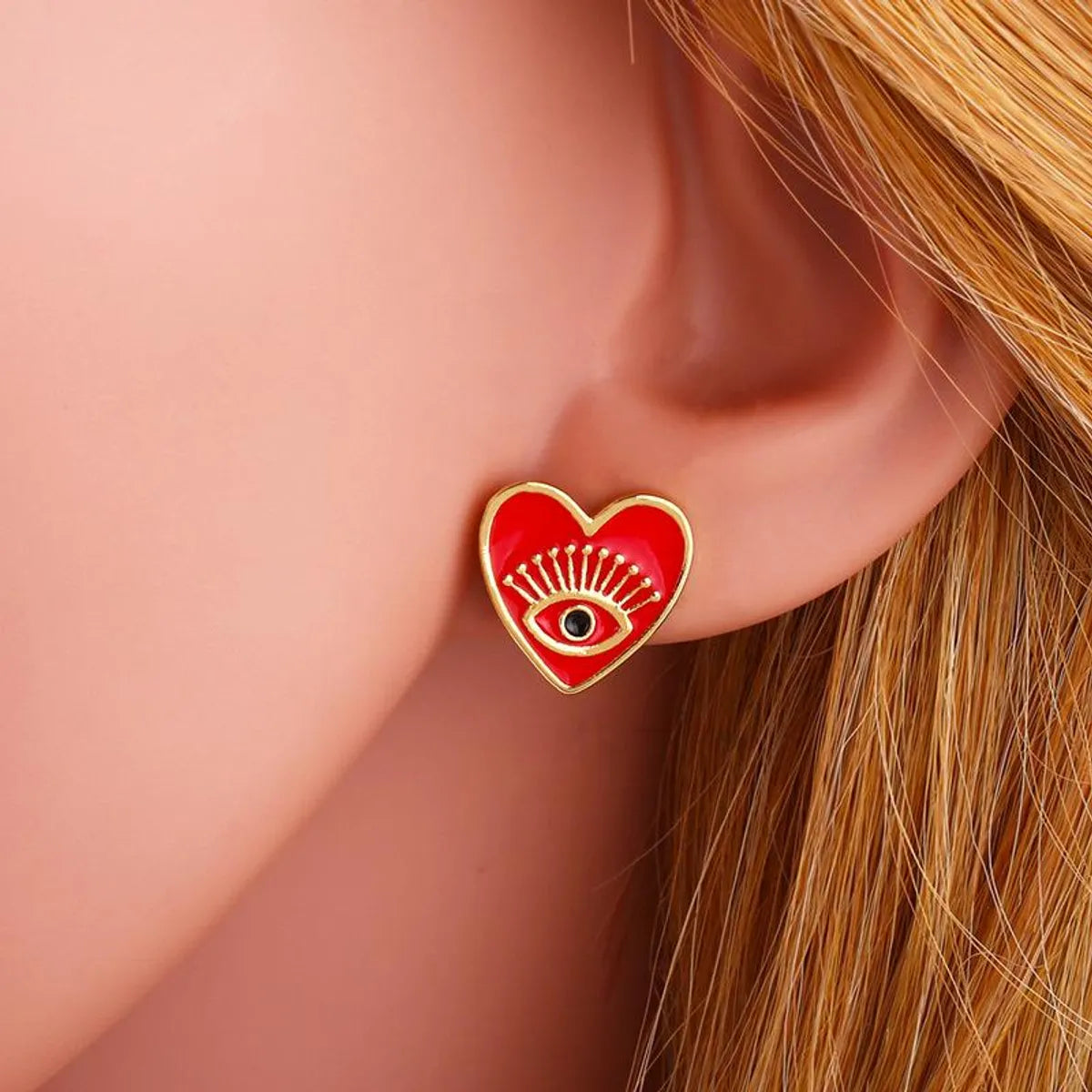 Fashion Copper Heart Shaped Eyes Stud Earrings Nhas155431