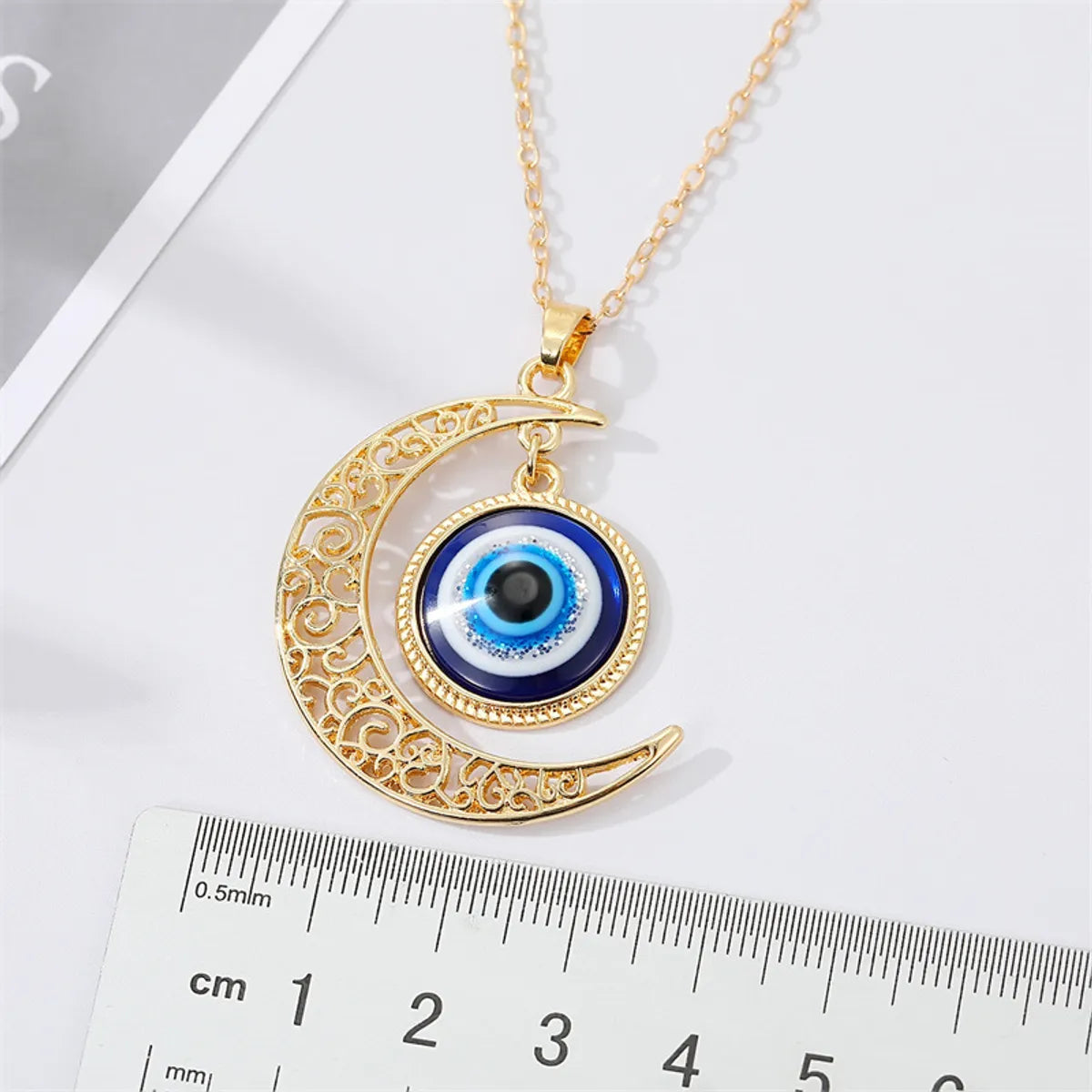 Fashion Retro Hollow Moon Blue Eye Alloy Necklace