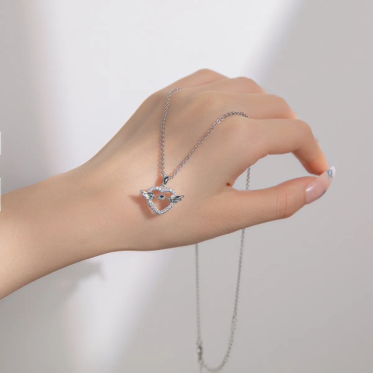 Ig Style Shiny Heart Shape Wings Titanium Steel Copper Plating Hollow Out Inlay Zircon Pendant Necklace