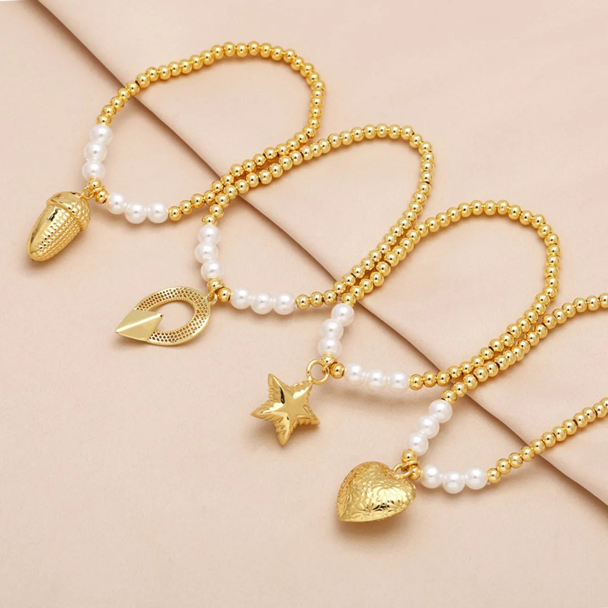 Modern Style Simple Style Pentagram Heart Shape 18K Gold Plated Artificial Pearl Copper Wholesale Bracelets