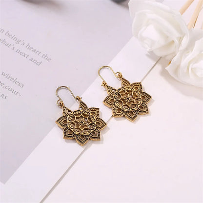 New Bohemian Metal Carved Retro Hollow Flowers Ear Buckle Earrings Wholesale