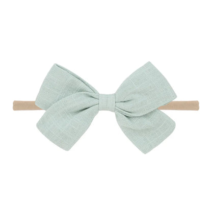 Nihaojewelry Cute Children'S Cotton And Linen Fabric Bow Hair Band Wholesale Jewelry