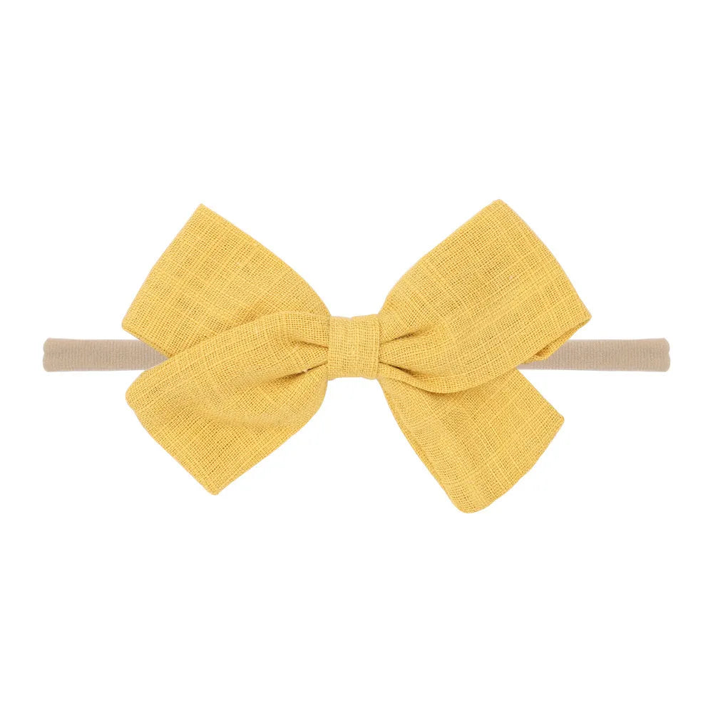 Nihaojewelry Cute Children'S Cotton And Linen Fabric Bow Hair Band Wholesale Jewelry