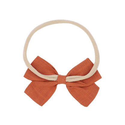 Nihaojewelry Cute Children'S Cotton And Linen Fabric Bow Hair Band Wholesale Jewelry