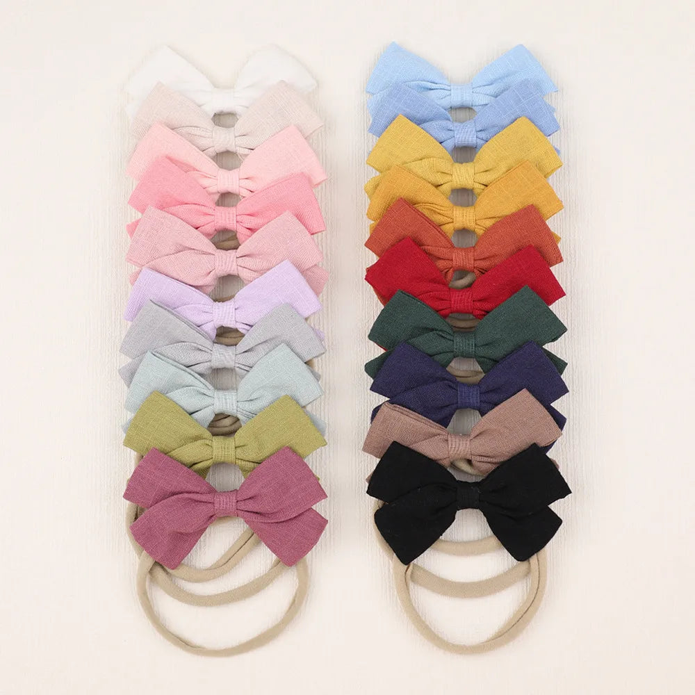 Nihaojewelry Cute Children'S Cotton And Linen Fabric Bow Hair Band Wholesale Jewelry