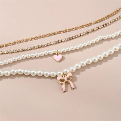 Princess Sweet Heart Shape Bow Knot Artificial Pearl Alloy Beaded Plating Inlay Rhinestones Girl'S Necklace