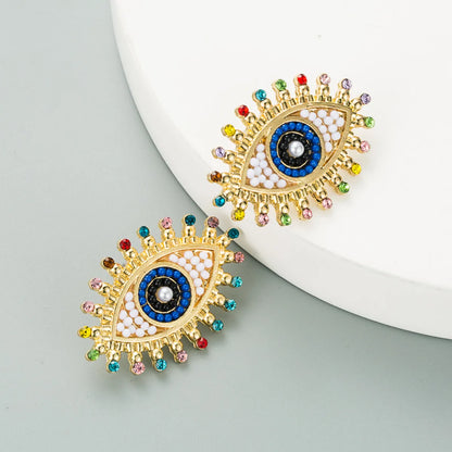 Retro Devil's Eye Alloy Inlaid Pearl Rhinestone Earrings