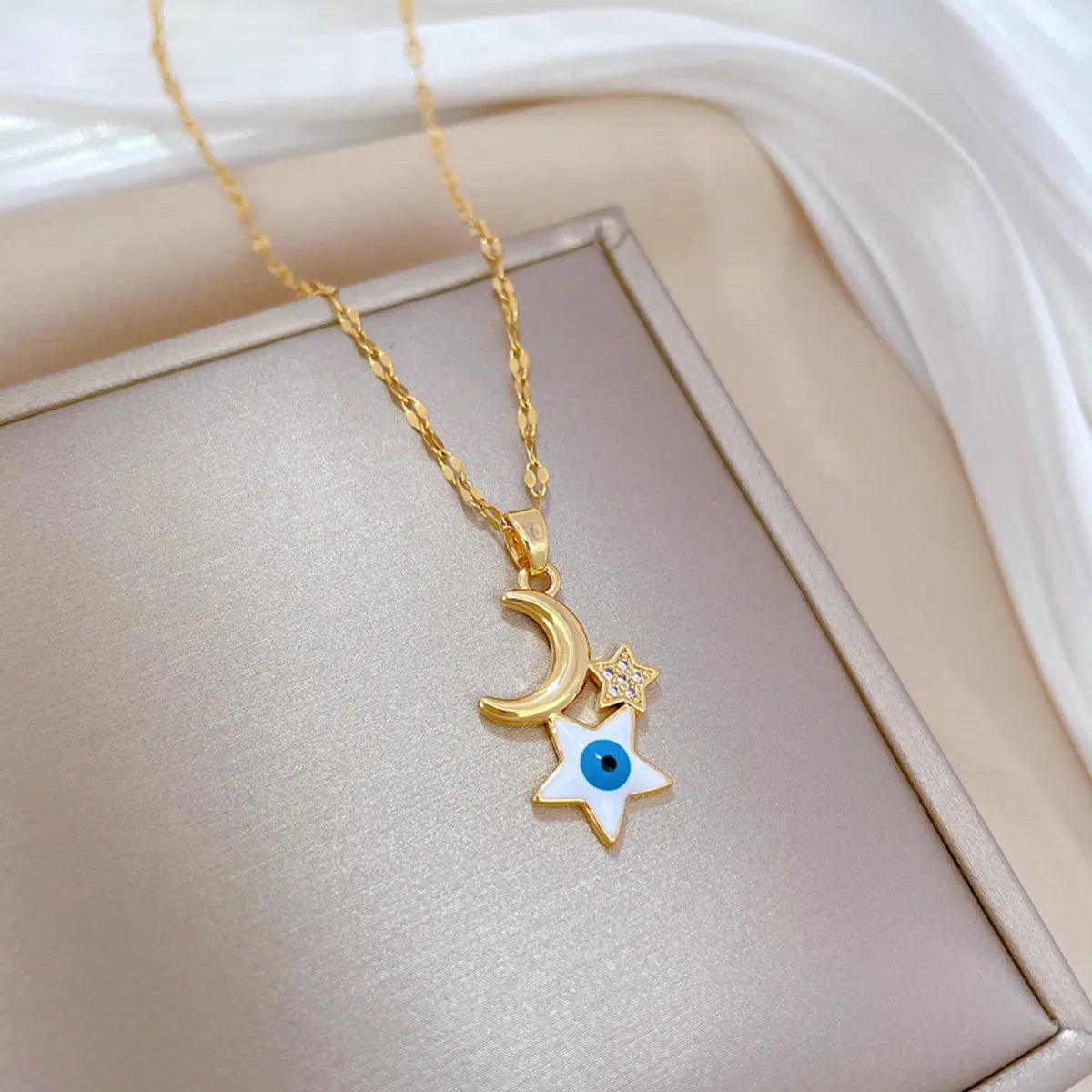 Wholesale Retro Devil'S Eye Star Moon Titanium Steel Copper Inlay Zircon Pendant Necklace