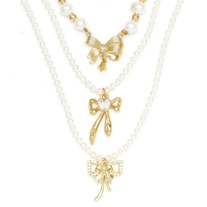 Simple Style Classic Style Bow Knot Imitation Pearl Copper Wholesale Pendant Necklace