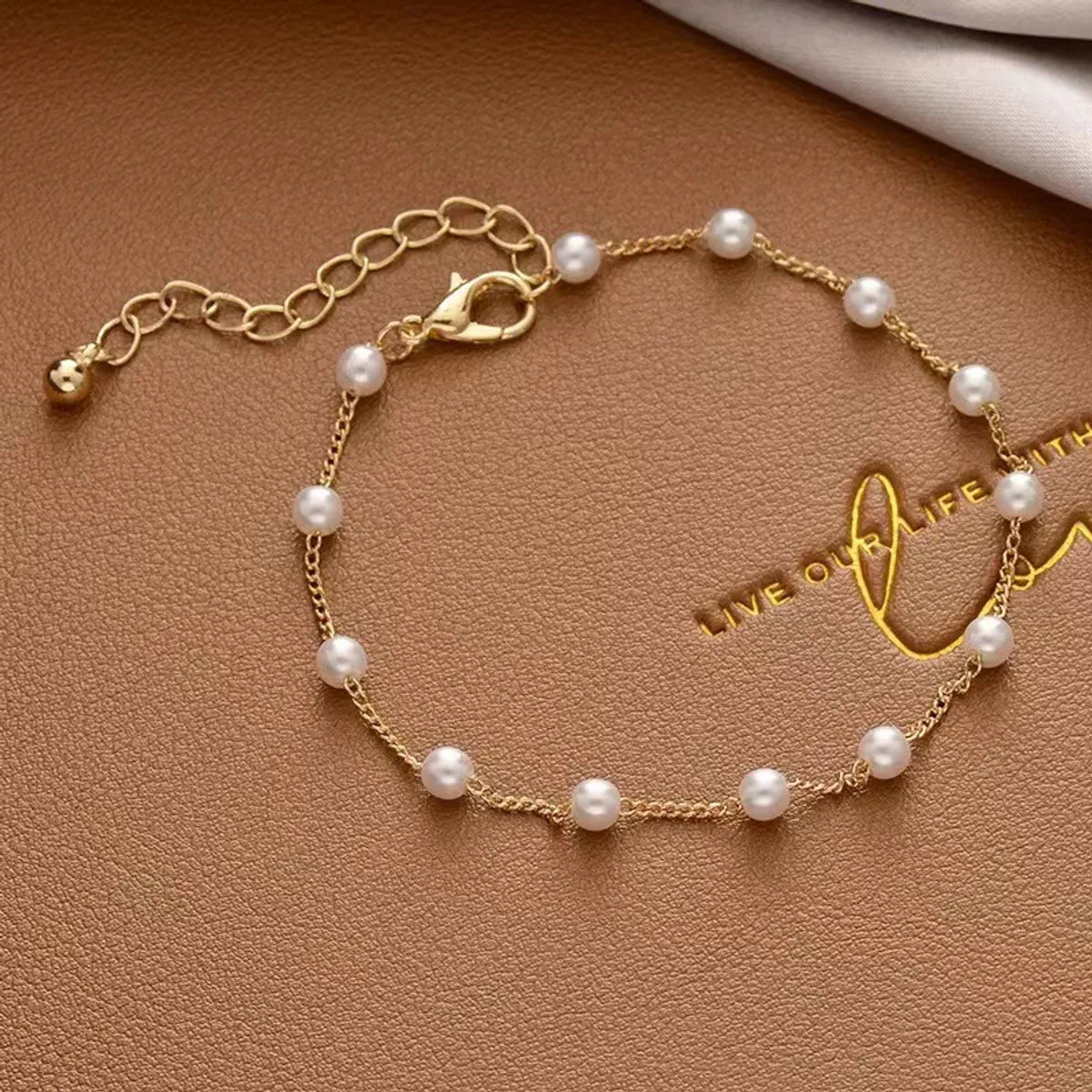 Simple Style Cross Heart Shape Artificial Pearl Alloy Plating Gold Plated Women'S Bracelets