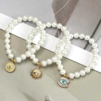 Simple Style Devil'S Eye Hand Of Fatima Artificial Pearl Glass Copper Wholesale Bracelets