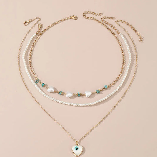 Simple Style Devil's Eye Heart Shape Turquoise Imitation Pearl Alloy Metal Wholesale Necklace