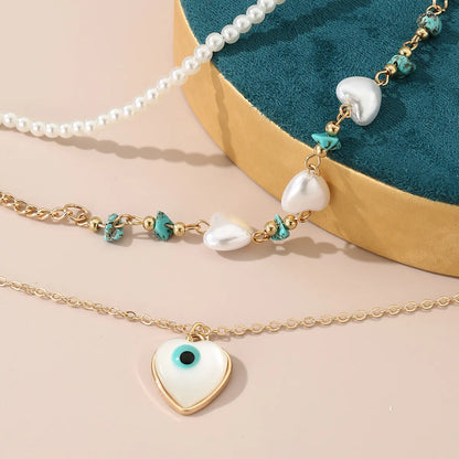 Simple Style Devil's Eye Heart Shape Turquoise Imitation Pearl Alloy Metal Wholesale Necklace