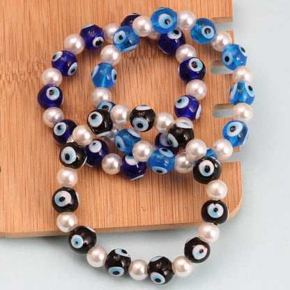 Simple Style Devil'S Eye Imitation Pearl Glass Wholesale Bracelets