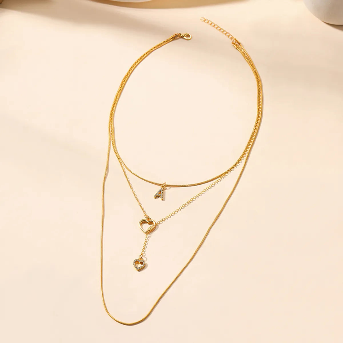 Simple Style Letter Heart Shape Alloy Hollow Out Inlay Rhinestones Women's Three Layer Necklace