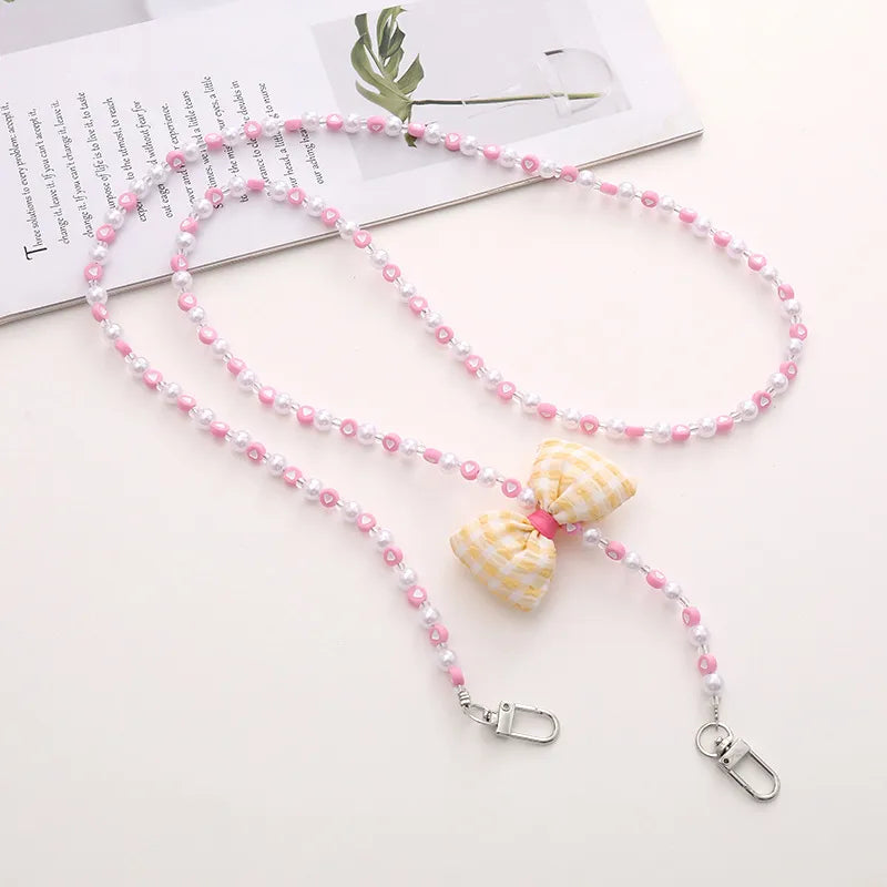 Simple Style Solid Color Bow Knot Arylic Nylon Beaded Mobile Phone Chain