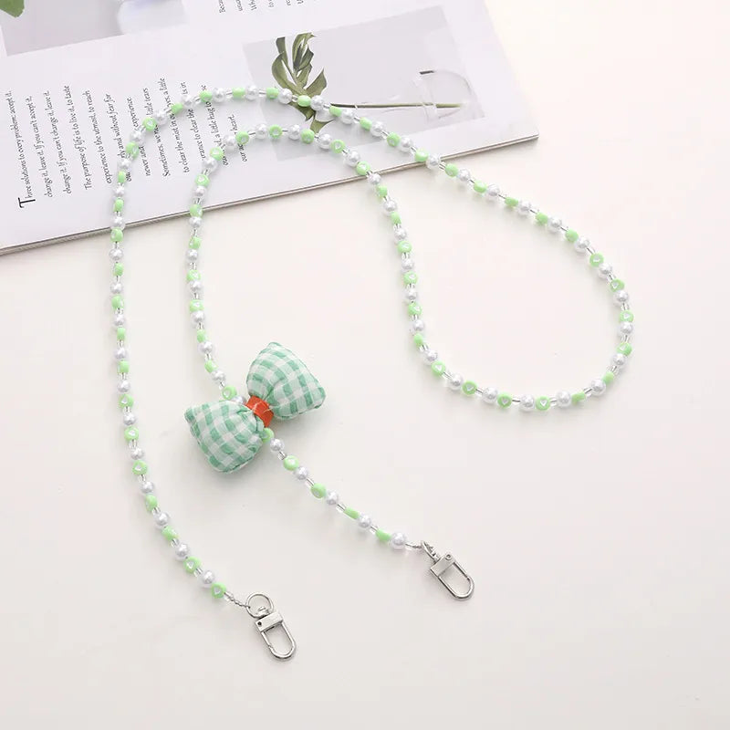 Simple Style Solid Color Bow Knot Arylic Nylon Beaded Mobile Phone Chain