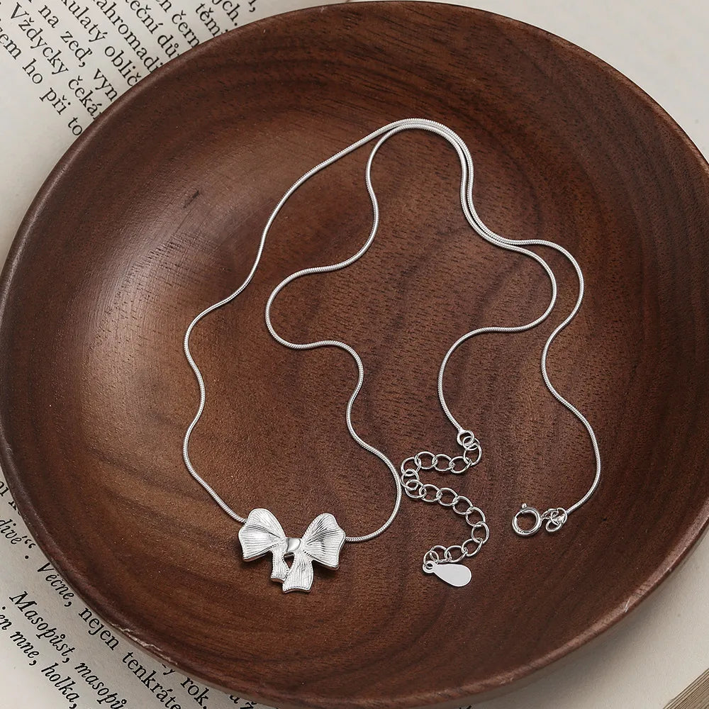 Sterling Silver Hollow Out Bow Knot Pendant Necklace