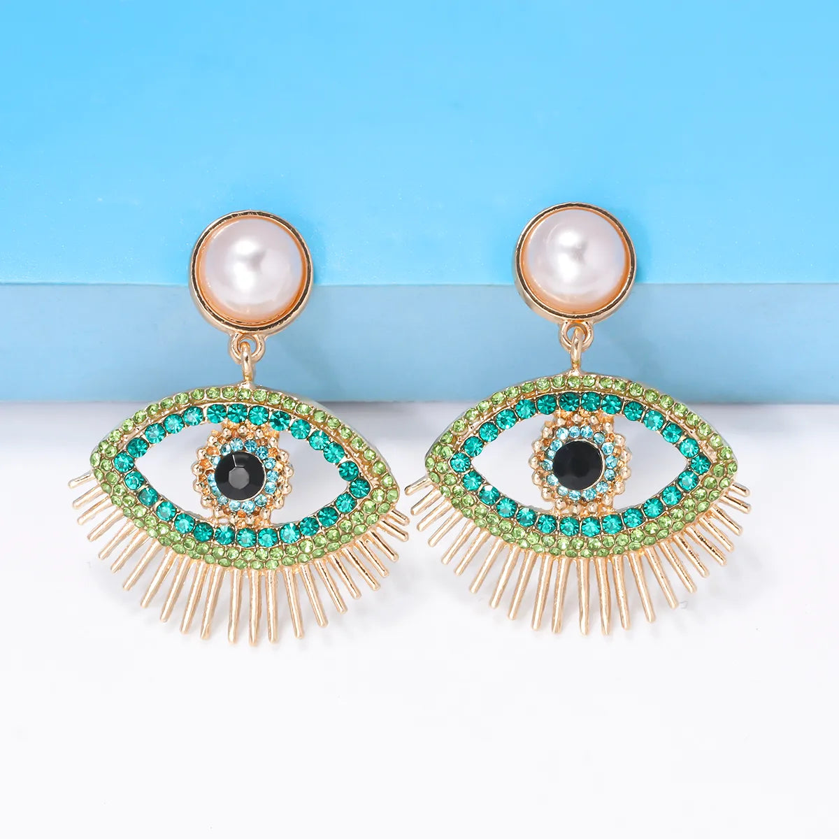 Streetwear Eye Imitation Pearl Alloy Plating Inlay Glass Stone Women'S Drop Earrings