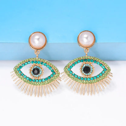 Streetwear Eye Imitation Pearl Alloy Plating Inlay Glass Stone Women'S Drop Earrings