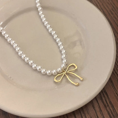 Sweet Bow Knot Imitation Pearl Alloy Wholesale Pendant Necklace