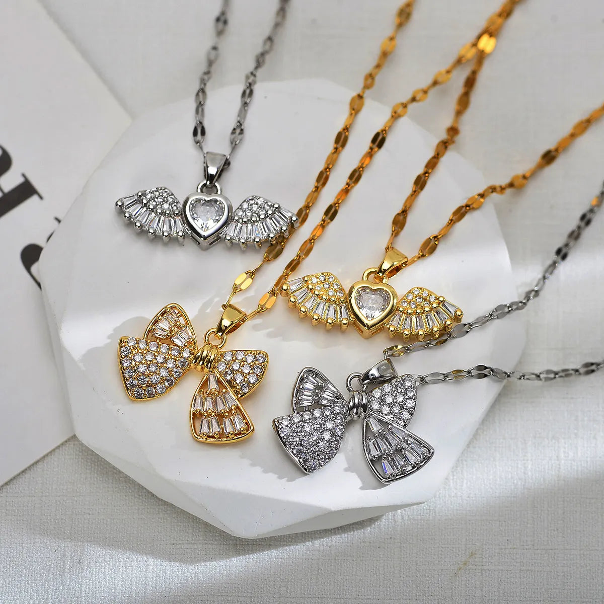 Wholesale Jewelry Sweet Wings Bow Knot Titanium Steel Copper Zircon Gold Plated Inlay Pendant Necklace