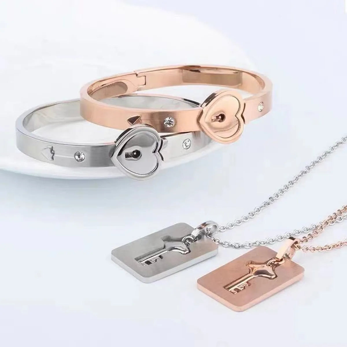 Titanium Steel Rose Gold Plated Elegant Simple Style Commute Hollow Out Inlay Heart Shape Key Lock Rhinestones Jewelry Set