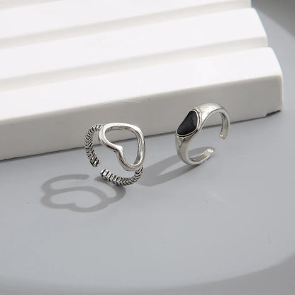 Vintage Black Heart-shaped Hollowed Dripping Oil Alloy Ring Two-piece Set Wholesale