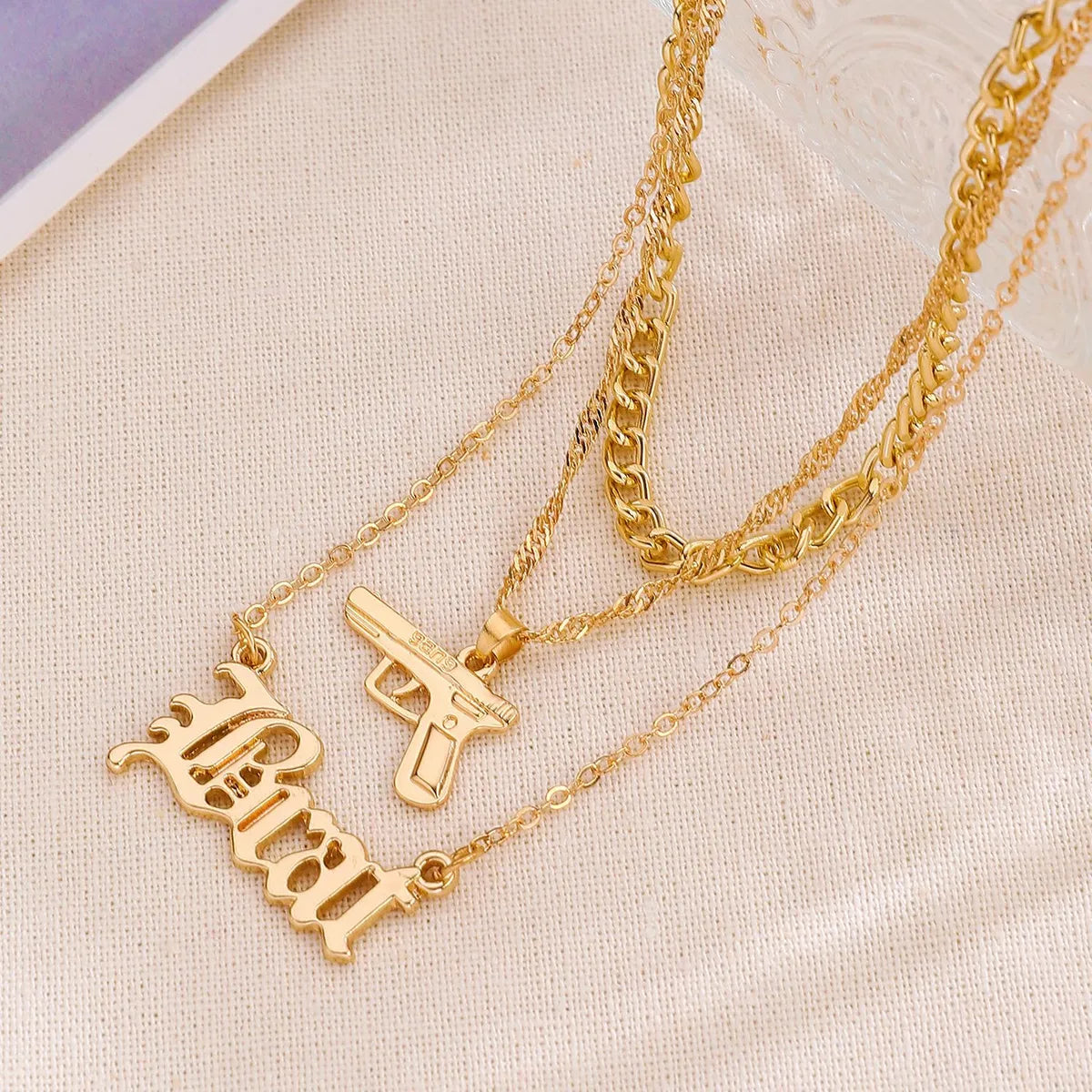 Wholesale Jewelry Simple Style Classic Style Letter Pistol Alloy Layered Necklaces