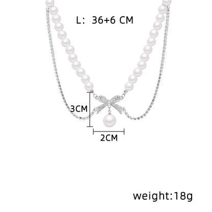 Wholesale Simple Style Commute Bow Knot Mother Pearl Shellfish Titanium Steel Beaded Layered Necklaces