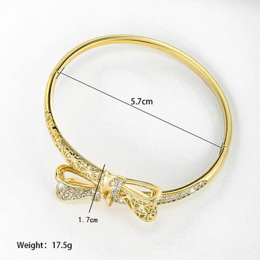 Xuping Shiny Bow Knot Alloy Plating Inlay Artificial Gemstones 14k Gold Plated Women'S Bangle